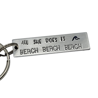 "All she does is beach, beach, beach" and "all he does is fish, fish, fish" SET ( 2 keychains) Hand Stamped Keychains - Travelers Trade Post
